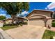 Charming single-Gathering home featuring a beige exterior, desert landscaping and a two-car garage at 23813 S Pleasant Way, Sun Lakes, AZ 85248