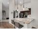 Open kitchen with granite countertops, pendant lights, and stainless steel appliances, perfect for cooking and entertaining at 23813 S Pleasant Way, Sun Lakes, AZ 85248