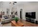 Spacious living room features hardwood floors and an open floor plan for entertaining at 23813 S Pleasant Way, Sun Lakes, AZ 85248