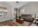 Bright living room with a vaulted ceiling, shuttered windows, and cozy seating area at 23813 S Pleasant Way, Sun Lakes, AZ 85248