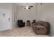 Cozy living room featuring tile flooring, neutral paint, ceiling fan and comfortable seating at 23813 S Pleasant Way, Sun Lakes, AZ 85248