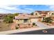 This aerial view highlights the home's well-kept landscaping and convenient three-car garage at 25540 N 103Rd Dr, Peoria, AZ 85383