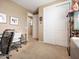 Inviting bedroom featuring closet space and neutral carpet, offering a versatile and cozy atmosphere at 25540 N 103Rd Dr, Peoria, AZ 85383