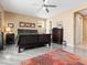 Well-appointed bedroom with wood flooring, neutral walls, ceiling fan, and ample space at 25540 N 103Rd Dr, Peoria, AZ 85383