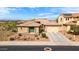 Beautiful single-story home features a three-car garage, well-manicured front yard, and desert landscaping at 25540 N 103Rd Dr, Peoria, AZ 85383