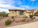 Charming single-story home with desert landscaping, a stone facade, and a well-maintained exterior at 25540 N 103Rd Dr, Peoria, AZ 85383