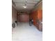 Well-organized garage featuring custom cabinets, providing ample storage space for vehicles, tools, and equipment at 25540 N 103Rd Dr, Peoria, AZ 85383