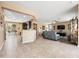 Open concept living area showcases hardwood floor and seamlessly connects the kitchen for convenient living at 25540 N 103Rd Dr, Peoria, AZ 85383