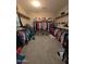 Spacious walk-in closet with ample hanging space and shelving for organized storage, offering convenience and style at 25540 N 103Rd Dr, Peoria, AZ 85383