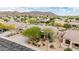 Aerial view of home with mature landscaping, desert plants, and mountain backdrop at 25845 N 44Th Ave, Phoenix, AZ 85083