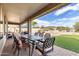Large backyard featuring an outdoor dining table, grassy area, and mountain views at 25845 N 44Th Ave, Phoenix, AZ 85083