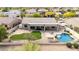 Beautiful backyard with artificial grass area, a swimming pool, patio, and desert landscaping at 25845 N 44Th Ave, Phoenix, AZ 85083