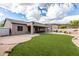 A lush backyard featuring turf, patio, and desert landscaping, perfect for outdoor living at 25845 N 44Th Ave, Phoenix, AZ 85083