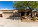 Tan single story home featuring desert landscaping and a three car garage at 25845 N 44Th Ave, Phoenix, AZ 85083