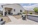 Well-maintained backyard featuring a covered patio, desert landscaping, pavers and modern storage at 25946 W Cat Balue Dr, Buckeye, AZ 85396