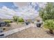 Relaxing backyard seating area with pavers, desert landscaping, and ample space for outdoor enjoyment at 25946 W Cat Balue Dr, Buckeye, AZ 85396