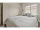 Inviting bedroom with closet, plush bedding, ceiling fan, and neutral decor at 25946 W Cat Balue Dr, Buckeye, AZ 85396