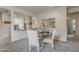 Cozy dining nook featuring a round table and an open view into the kitchen area at 25946 W Cat Balue Dr, Buckeye, AZ 85396