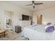 Spacious main bedroom with large windows, ceiling fan, and en-suite bathroom at 25946 W Cat Balue Dr, Buckeye, AZ 85396