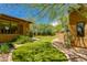 Spacious backyard with lush green lawn surrounded by desert landscaping, enhancing outdoor living and privacy at 26156 N 88Th Way, Scottsdale, AZ 85255