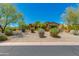 Charming desert home featuring manicured landscaping, natural desert plants and great curb appeal at 26156 N 88Th Way, Scottsdale, AZ 85255