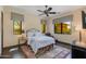 Relaxing main bedroom with natural light, a decorative rug, and a stylish wrought iron bed frame at 26156 N 88Th Way, Scottsdale, AZ 85255