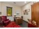 Home office with a wooden desk, red leather chair, and built-in shelving that provides the perfect workspace at 26156 N 88Th Way, Scottsdale, AZ 85255