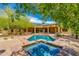 Private pool with jacuzzi and desert landscaping, designed for relaxation and entertainment in the backyard at 26156 N 88Th Way, Scottsdale, AZ 85255