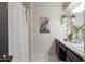 Bathroom featuring dual sinks, marble countertops, and ample lighting, creating a functional space at 2938 S Country Club Way, Tempe, AZ 85282