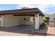 Attached covered carport with decorative dark beams and exterior sconces at 2938 S Country Club Way, Tempe, AZ 85282