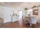 Bright dining space featuring a decorative chandelier and seating for four at 2938 S Country Club Way, Tempe, AZ 85282