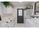 Functional laundry room with white cabinets, ample counter space, and modern washer/dryer, conveniently located at 2938 S Country Club Way, Tempe, AZ 85282