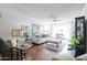 Bright living room with hardwood floors, neutral decor, and a ceiling fan at 2938 S Country Club Way, Tempe, AZ 85282