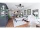 Open living room with hardwood floors, dining area, and neutral color palette at 2938 S Country Club Way, Tempe, AZ 85282