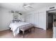 Comfortable main bedroom featuring wood floors, ceiling fan, closet, and a cozy decor for relaxation at 2938 S Country Club Way, Tempe, AZ 85282