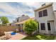 Relaxing backyard featuring a brick patio, small lawn and a blooming tree offering shade at 3134 E Mckellips Rd # 139, Mesa, AZ 85213