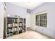 A bright bedroom with light purple walls, featuring bookshelves and a large window letting in natural light at 3134 E Mckellips Rd # 139, Mesa, AZ 85213