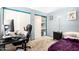 A bedroom with light blue walls, featuring a desk, sliding closet doors, and a comfortable bed at 3134 E Mckellips Rd # 139, Mesa, AZ 85213