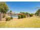 Community pool area with fence, landscaping, and clear blue water on a sunny day at 3134 E Mckellips Rd # 139, Mesa, AZ 85213
