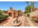 Charming backyard featuring a well-maintained patio, fountain, manicured landscaping, and lovely plants at 3234 E Briarwood Ter, Phoenix, AZ 85048