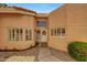 Charming home entrance with a decorative wreath on the front door and beautifully landscaped front yard at 3234 E Briarwood Ter, Phoenix, AZ 85048