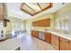 Charming kitchen featuring tile floors, wooden cabinets, and a breakfast bar area with seating at 3234 E Briarwood Ter, Phoenix, AZ 85048