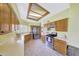 Bright kitchen featuring wood cabinets, modern stainless steel appliances, and ample counter space at 3234 E Briarwood Ter, Phoenix, AZ 85048