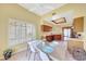 Eat-in kitchen with a view of the large window, white countertops, stainless steel fridge, and skylight at 3234 E Briarwood Ter, Phoenix, AZ 85048