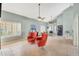 Well-lit living room with vaulted ceilings, ample seating, and large windows with plantation shutters at 3234 E Briarwood Ter, Phoenix, AZ 85048