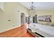 Main bedroom with wood floors, access to bathroom, and a door to backyard at 3234 E Briarwood Ter, Phoenix, AZ 85048