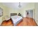 Large bedroom with wood floors, a chandelier, a vaulted ceiling, and view of backyard at 3234 E Briarwood Ter, Phoenix, AZ 85048