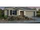Charming single-story home with stone accents, shutters, and a well-manicured front yard at 3524 N 103Rd Ave, Avondale, AZ 85392