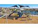 Community playground with climbing structures, slides, and shade at 3524 N 103Rd Ave, Avondale, AZ 85392