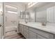 Spacious bathroom features dual sinks, a large mirror, and a shower-tub combo at 3580 E Kesler Ln, Gilbert, AZ 85295